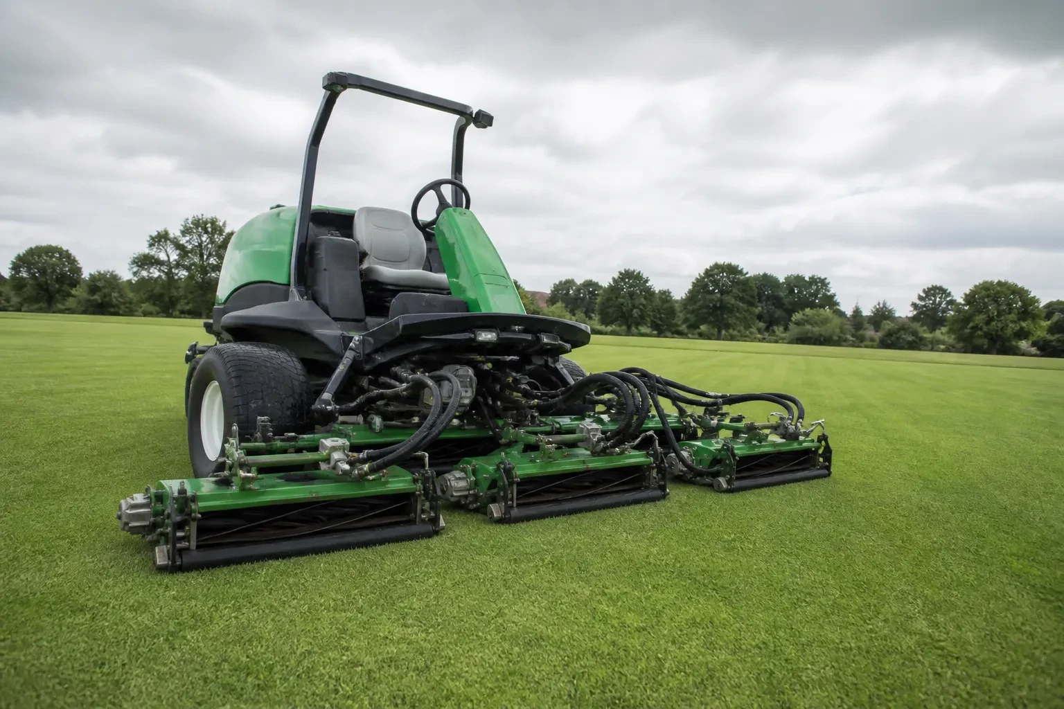 Gang reel mower cutting a wide turf area